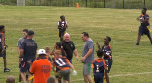 Troy Police and Fire Departments play  football with Charles Henderson Middle School.