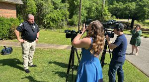 Student journalists report at simulated crime scene