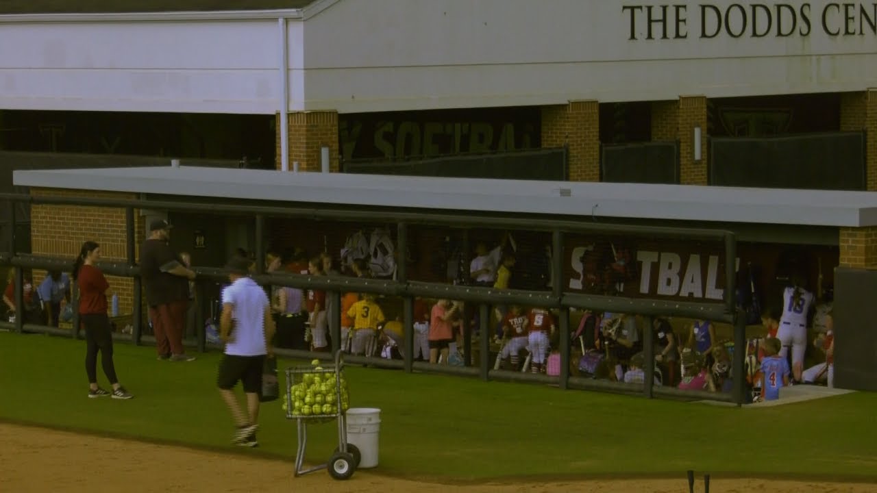 Softball coach Eric Newell holds youth softball camp