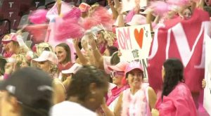 Students celebrate football and basketball season during pep rally and Trojan Madness