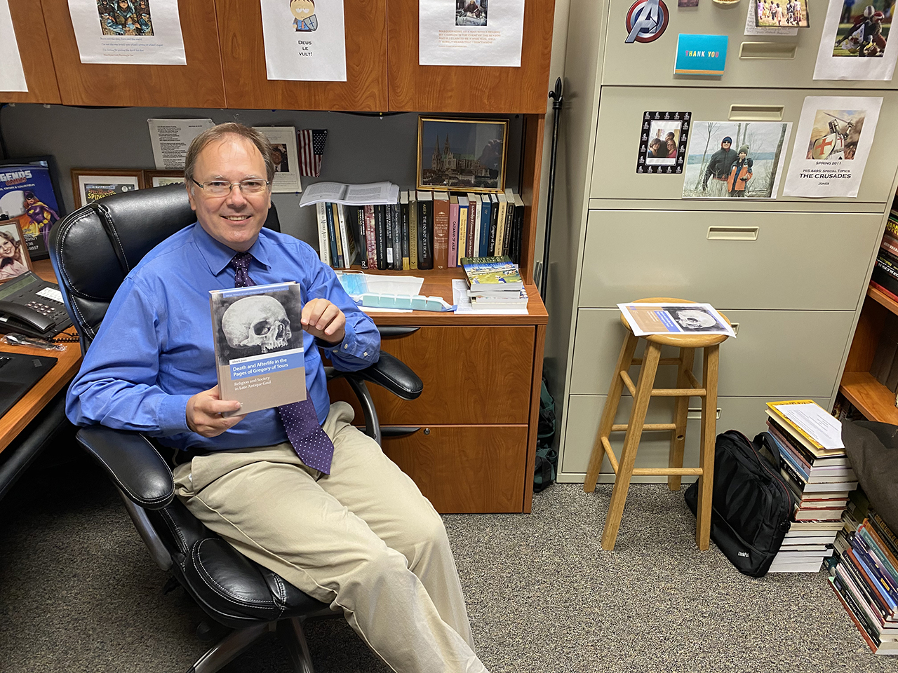 Professor’s new book features art from TROY colleague Troy Today