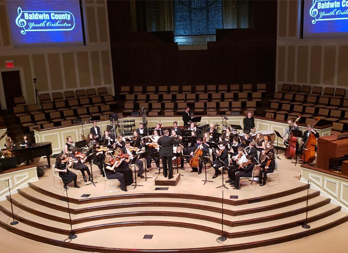 TROY Music students, faculty bring spirit to youth orchestra