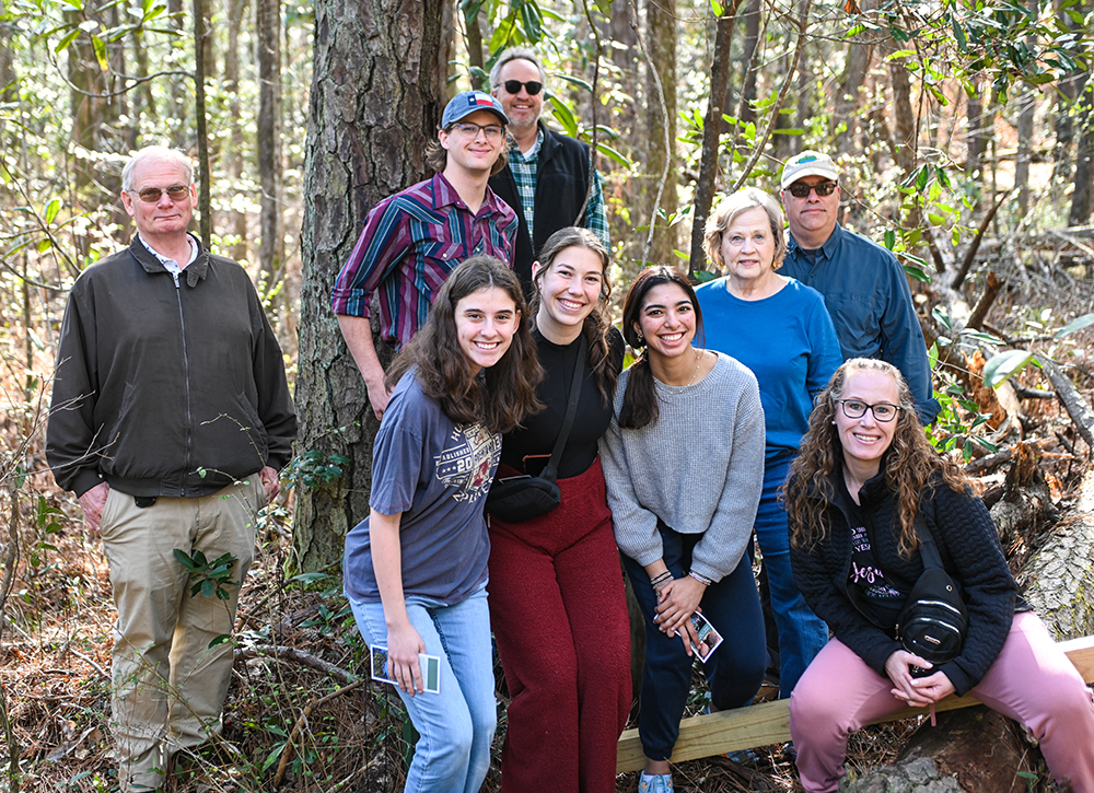 A group photo in front of the tree.