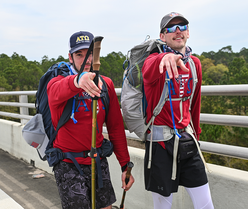 Walkers cross over the Hathaway Bridge into Panama City.