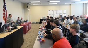 Army Lt. Col. Heather Olmo addresses students during the Hap Arnold Leadership Forum at the Phenix City Campus on April 25.