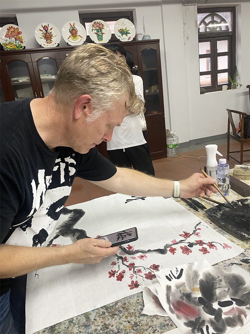 Greg Skaggs paints during one of his studio sessions