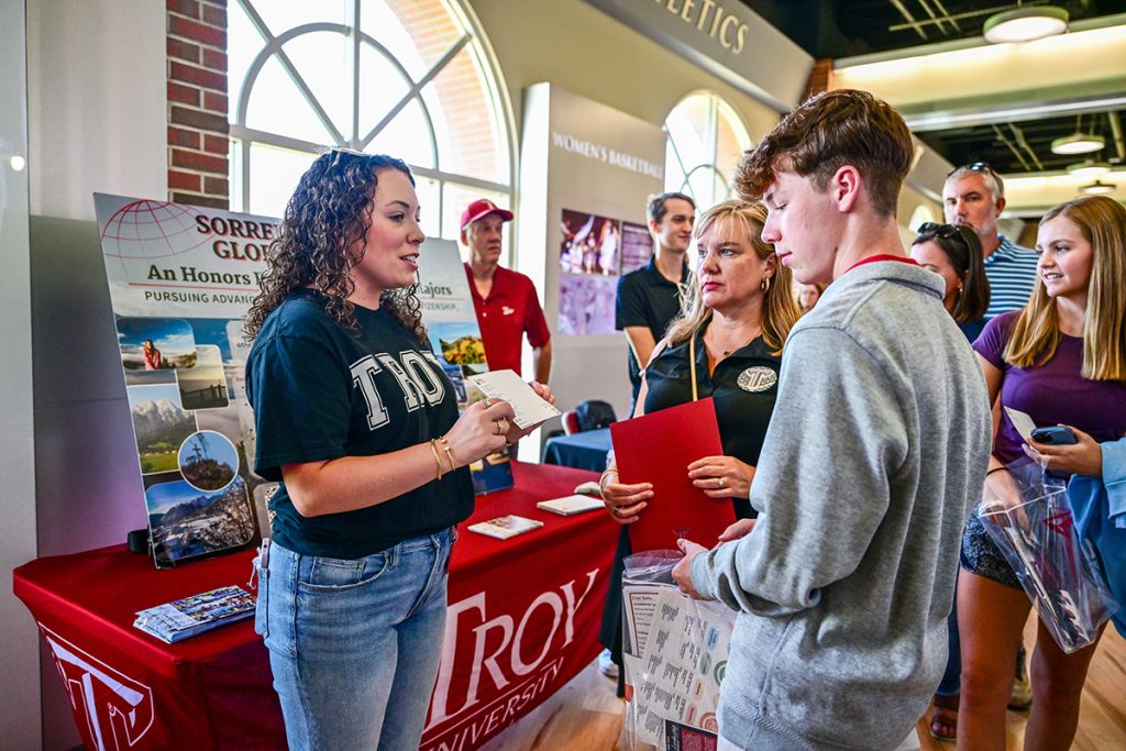 A prospective student visits with one of the booths during the browse session.