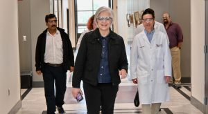 Melanie Hill, Senator Britt's field representative touring CMMS Building on TROY