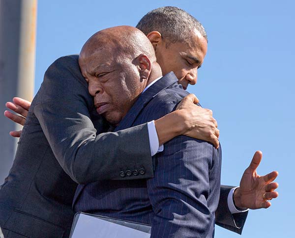 The President hugs Rep. John Lewis after his introduction. 
(Official White House Photo by Pete Souza)