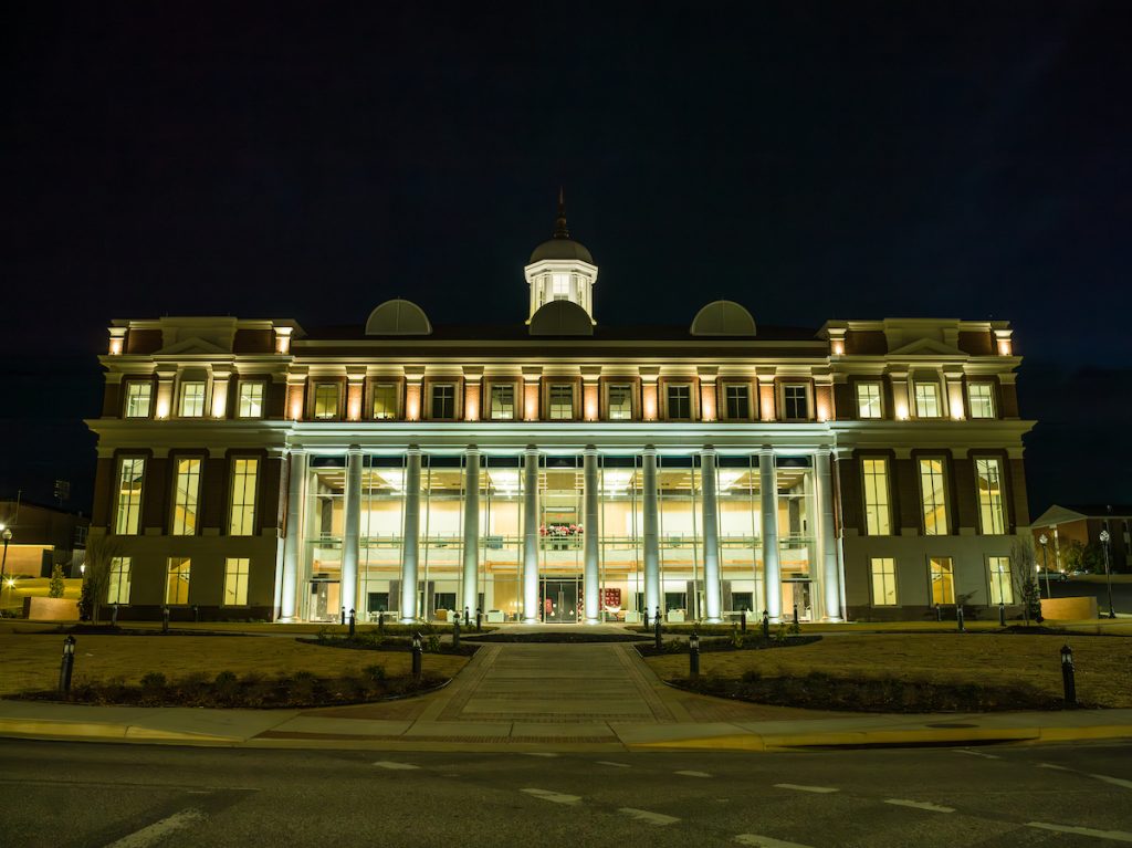 Nighttime photo of Jones Hall, the new home of Troy University's College of Health Sciences