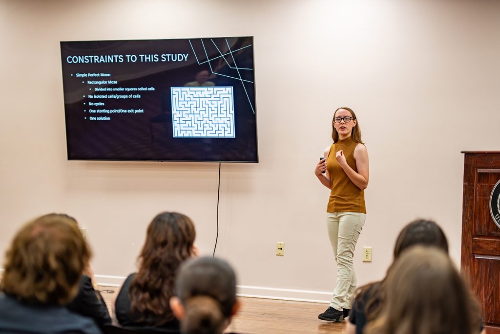 Student Kassidy Adams presenting her research, "The Applications of Graph Theory in Modeling Mazes."
