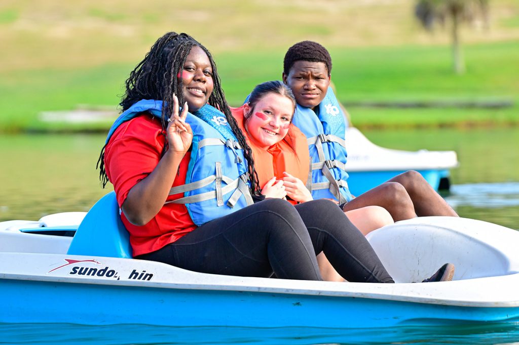 Student paddle boating at Butter & Egg Adventures.
