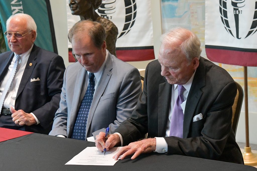 Sherrill Crowe signs an agreement with TROY