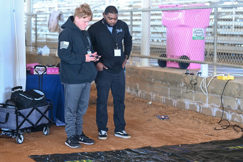 A student practices flying a drone during the 2025 AgriSTEM Expo.