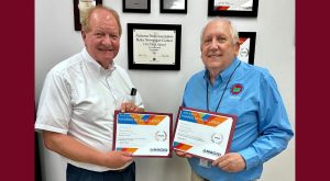 TROY alum wins two national communication awards