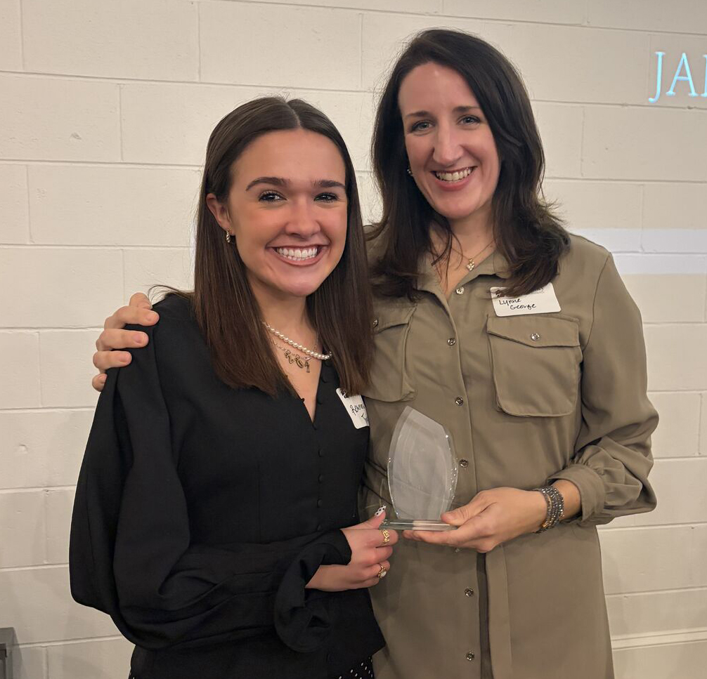 Reanna and Lynne holding an award