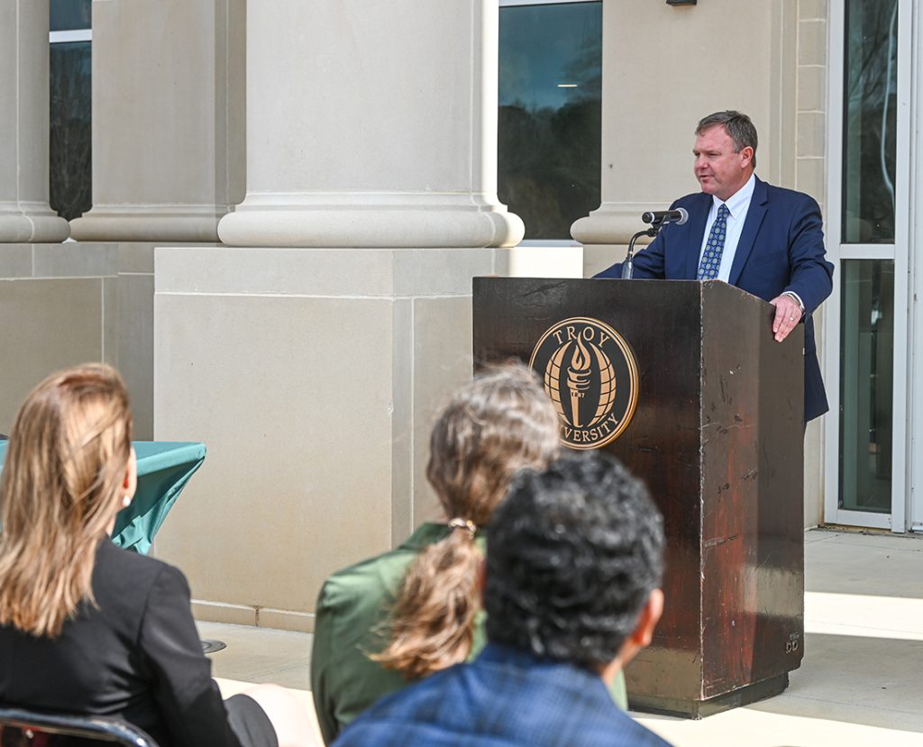 ESCC President Daniel Long speaking at the podium