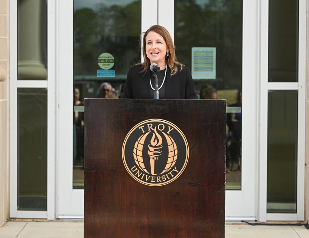 Dr. Anna Head speaking at the podium