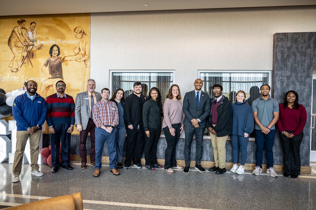 Shomari Figures with health sciences students in Jones Hall