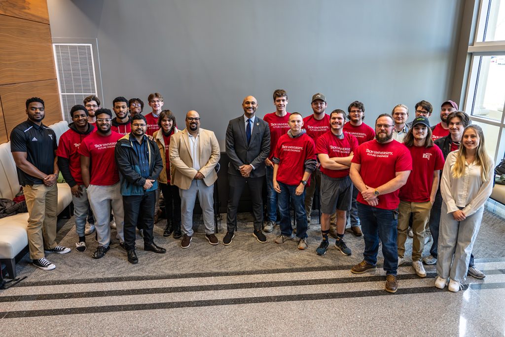 Alabama Congressman Shomari Figures visits with engineering students in the CMMS building.