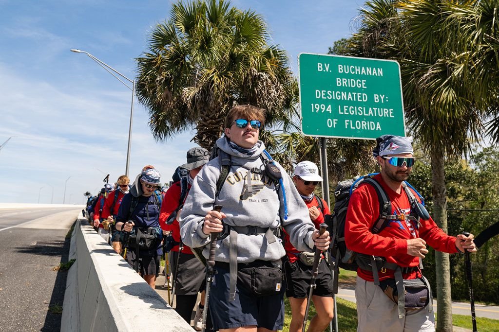 Walkers cross the bridge into Panama City.