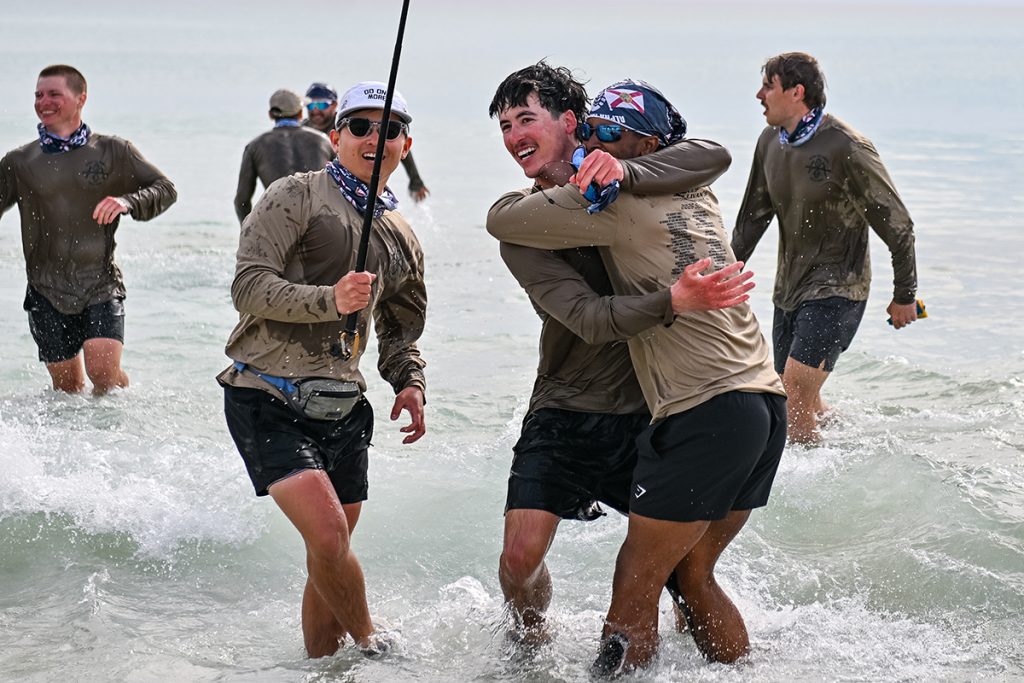 ATO brothers celebrate and hug in the ocean at Panama City Beach
