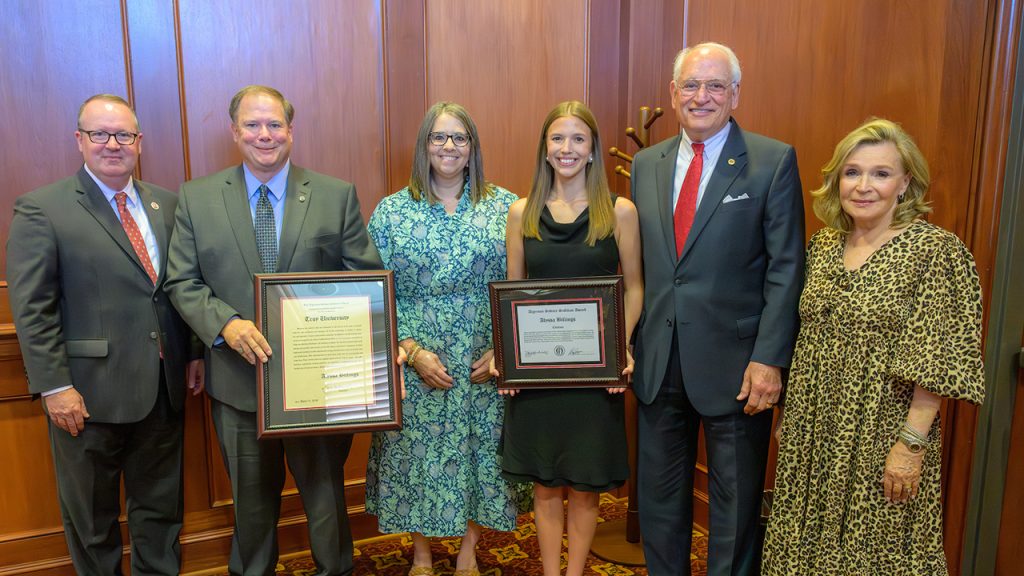 Dr. Kerry Palmer, Dr. Jack Hawkins, Jr. and Mrs. Janice Hawkins with Sullivan Award winner Alyssa Billings and her parents.