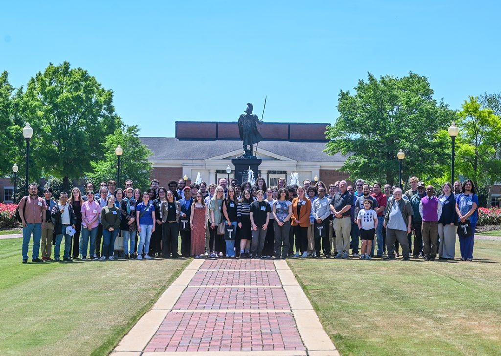 a group photo of MathFest participants on the troy university academic quad in front of the fountain