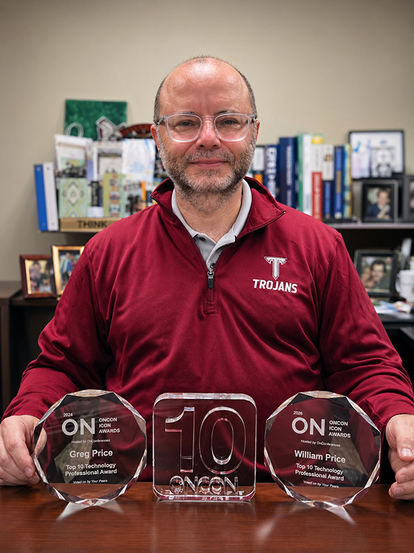 a photo of Greg Price with ON awards