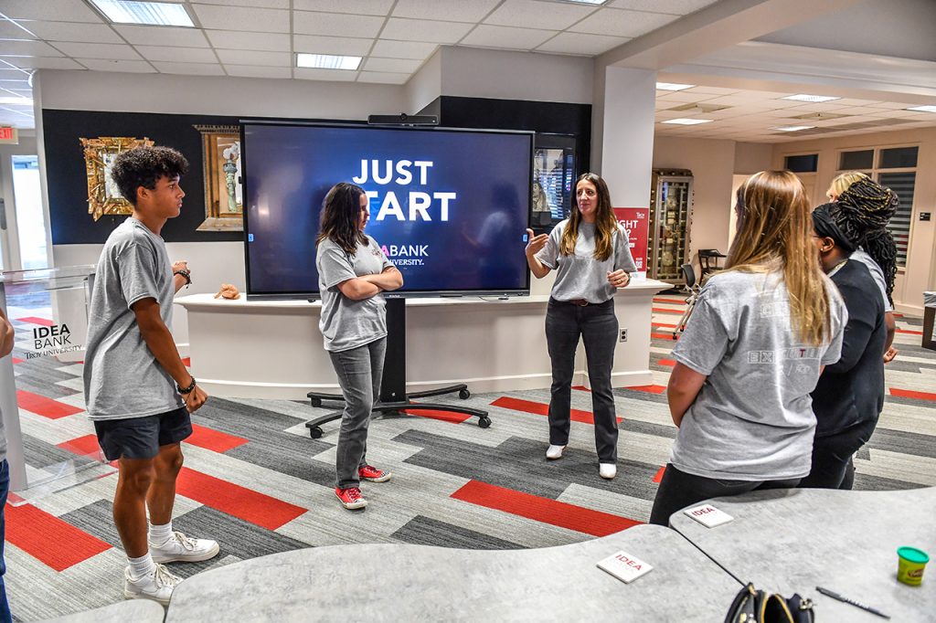 A group of high school students being led in an exercise at the IDEA Bank