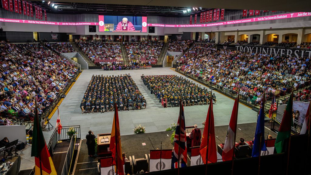 Graduates inside Trojan Arena for Troy University's spring commencement ceremonies.
