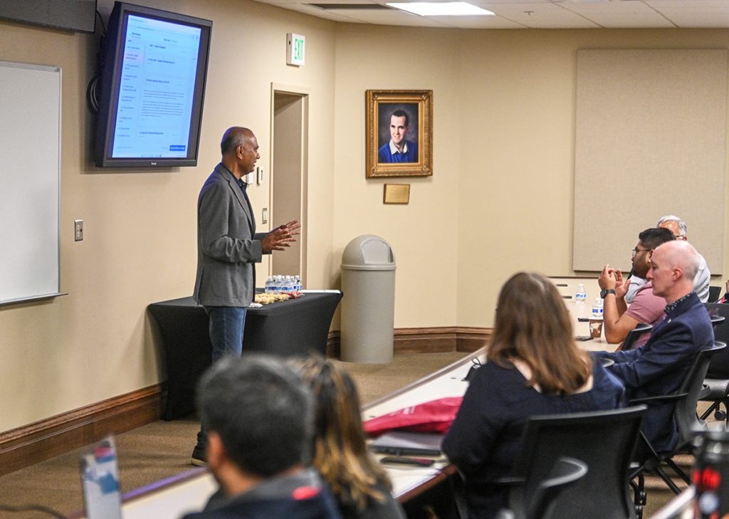 A conference presenter talks during a workshop on the first day of ACMSE 2026.