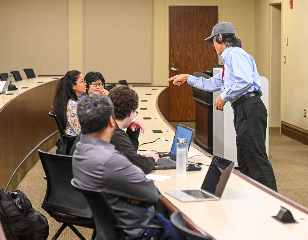 a conference speaker interacts with attendees during a session.