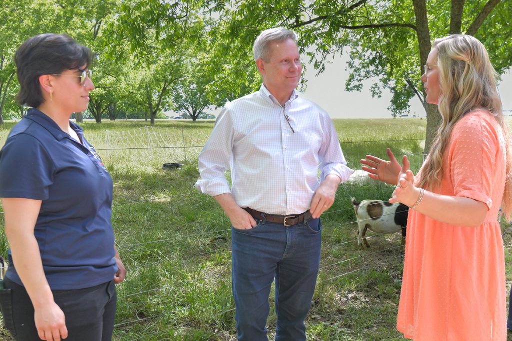 a photo of three people talking