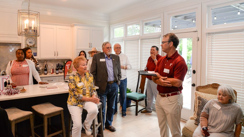 Montgomery Metro Alumni Chapter President Bryan Hubbard addresses a chapter gathering at the home of Alumni Director Faith Byrd.