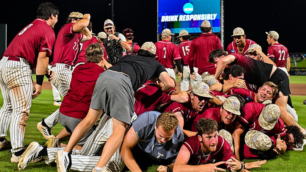 Members of the TROY baseball team celebrate their win in the NCAA's Gainesville, FL Regional following a 10-2 win over the Florida Gators