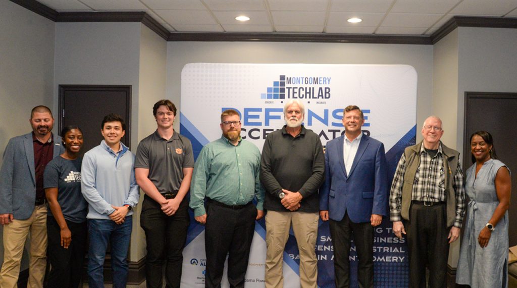 Members of the first cohort of the Montgomery TechLab's Summer Defense Accelerator pose for photo during a reception of Troy University's Montgomery Campus.