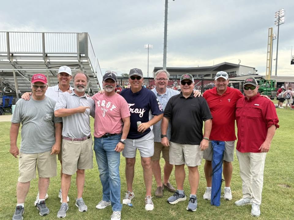 Bryan Wallace, center with, SAE alumni at the Super Regional game.