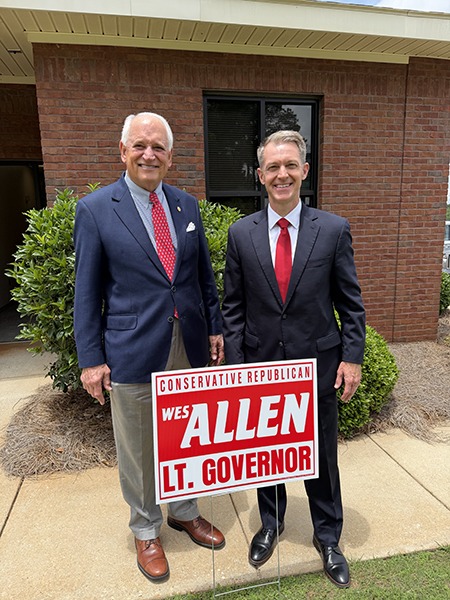 Dr. Jack Hawkins, Jr. with Wes Allen behind campaign sign for Allen's bid for Alabama's Lt. Governor.