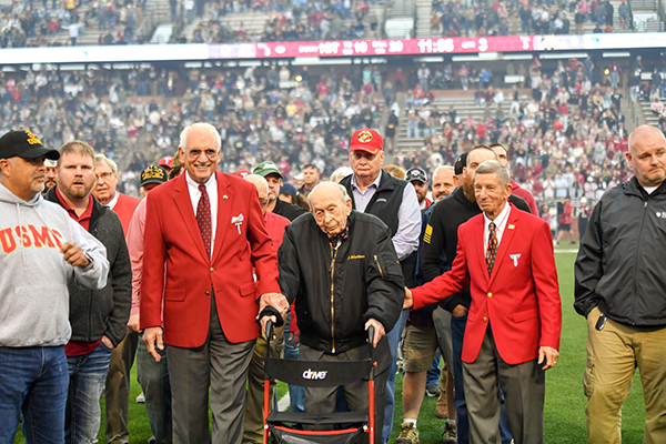 TROY Trustee and the longest living Marine Roy Drinkard, along with Chancellor Jack Hawkins, Jr. and Dr. John Schmidt, leads the procession of Marine veterans during the University's military appreciation football game.