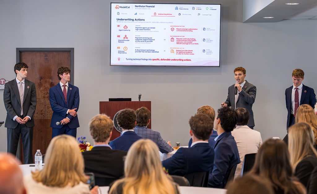 four students presenting a project