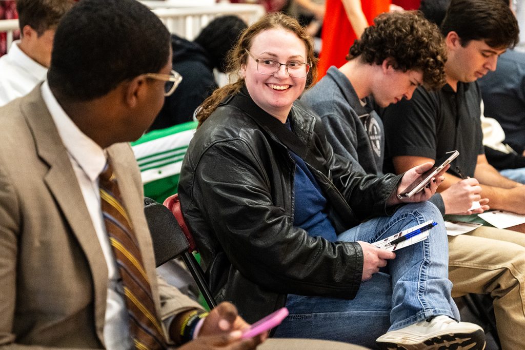 students conversing in a classroom